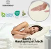 A woman sleeping peacefully on a bed, with marketing text and certifications overlaid. Produktbild-Vorschau