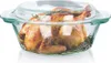 A roasted chicken with rosemary in a glass baking dish. Podgląd zdjęcia produktu