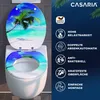 A toilet seat and lid decorated with a tropical beach scene, displayed on a toilet. The right side of the image features marketing text and icons. Anteprima dell’immagine prodotto