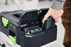 A person's hand is placing a Festool battery into a storage compartment on a Festool tool case. Anteprima dell’immagine prodotto