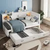 A white daybed with a pull-out trundle bed, set up in a child's bedroom with blue walls and a rug. Produktbild-Vorschau