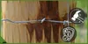 A close-up of wire fencing attached to a wooden post, with two circular icons on the right side. Podgląd zdjęcia produktu