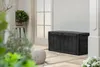 An outdoor patio scene with a black storage box, a potted plant, and a textured ottoman. Anteprima dell’immagine prodotto