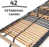 A close-up view of a slatted bed base, showing the wooden slats and their black plastic connectors. Produktbild-Vorschau