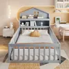 A child's bedroom with a grey house-shaped bed, a desk, and a bookshelf. Náhled obrázku produktu