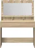 A vanity table with a mirror and lights. Voir les images du produit