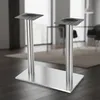 A product shot of a double table leg base in a modern interior setting. Voir les images du produit
