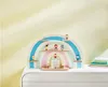 A wooden rainbow-shaped shelf with small figures displayed on it, placed on top of a white dresser. Produktbild-Vorschau