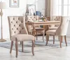 A dining room scene with a wooden table and chairs. Anteprima dell’immagine prodotto