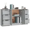 A grey wooden sideboard with multiple drawers and shelves, decorated with books and decorative items. Produktbild-Vorschau