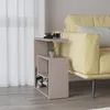 A side table next to a yellow sofa in a living room. Anteprima dell’immagine prodotto