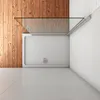 A top-down view of a modern shower enclosure with a glass door and a white shower tray, set against a wooden wall and tiled floor. Produktbild-Vorschau