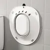 A white bidet seat attachment is mounted on a tiled wall above a toilet. Produktbild-Vorschau