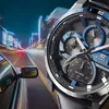 A close-up of a Casio Edifice watch with a blurred background of a car driving through a city at night. Voir les images du produit