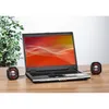 A laptop computer with two small speakers on a wooden desk. Produktbild-Vorschau
