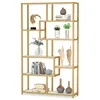A gold-colored bookshelf with various decorative items on its shelves. Produktbild-Vorschau