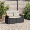A patio setting with a two-seater sofa, plants, and string lights. Náhľad obrázku produktu
