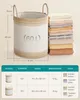 A laundry basket with dimensions and capacity information, alongside a table detailing product specifications. Náhled obrázku produktu