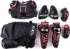 A collection of hockey protective gear laid out on a white background. Podgląd zdjęcia produktu