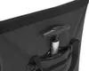 A close-up view of the interior of a black tote bag, showing a handle of a pump or similar device tucked into a zippered pocket. Náhled obrázku produktu