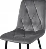 A close-up view of a gray velvet upholstered chair. Anteprima dell’immagine prodotto