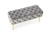 A gray upholstered bench with gold legs on a white background. Produktbild-Vorschau