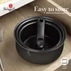 A set of nested pots with a detachable handle is shown in a kitchen drawer, emphasizing easy storage. Voir les images du produit