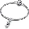 A silver Pandora bracelet with a dangling charm of a skier. Voir les images du produit
