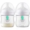 Two Philips Avent baby bottles are shown side-by-side against a white background. One bottle contains a light-colored liquid, while the other is empty. Podgląd zdjęcia produktu