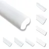A collection of white decorative molding profiles against a white background. Produktbild-Vorschau