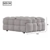 A diagram showing the dimensions of a gray upholstered ottoman or daybed. Podgląd zdjęcia produktu
