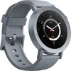 A close-up, angled view of a gray smartwatch with a black face and a gray band, set against a white background. Podgląd zdjęcia produktu