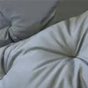 A close-up view of a tufted gray cushion, likely for a garden bench or swing. Náhled obrázku produktu