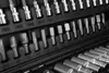 A close-up view of a tool kit, showing various sockets and bits organized in a black case. Anteprima dell’immagine prodotto