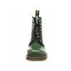 A front view of a green Dr. Martens boot on a white background. Produktbild-Vorschau