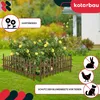 A garden fence protecting a rose bush with yellow flowers. Náhled obrázku produktu