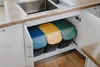 Three recycling bins are neatly arranged under a kitchen sink. Produktbild-Vorschau