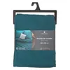A teal colored quilt cover is displayed in its packaging, hanging from a black hanger. Anteprima dell’immagine prodotto