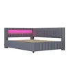 A gray upholstered L-shaped bed frame with a pink LED light strip integrated into the headboard, shown against a white background. Náhled obrázku produktu