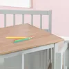 A close-up view of a wooden table with colored pencils on it, part of a children's furniture set. Produktbild-Vorschau