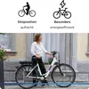 A woman is standing next to a white electric bicycle in front of a building. Anteprima dell’immagine prodotto