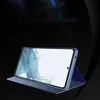 A blue smartphone case with a phone inside, displayed in a studio setting with a dark background. Náhled obrázku produktu