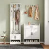 A hallway or entryway with a white coat rack and shoe cabinet set. Produktbild-Vorschau