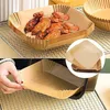 A collage showing air fryer paper liners filled with chicken wings and a hand placing a liner into an air fryer basket. Produktbild-Vorschau