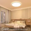 A bedroom with a bed, nightstands, and curtains, illuminated by a ceiling light. Produktbild-Vorschau