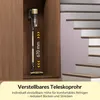 A vacuum cleaner is shown mounted on a wall inside a wooden cabinet, next to a staircase. Produktbild-Vorschau