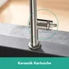 A close-up of a kitchen faucet with a green circle highlighting the ceramic cartridge. Produktbild-Vorschau