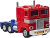 A toy truck, specifically Optimus Prime from Transformers, shown from a three-quarter front angle against a white background. Produktbild-Vorschau