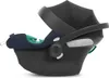 A side view of a black baby car seat with navy blue and green interior padding. Náhľad obrázku produktu