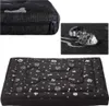 A collage of images showing a dog bed with a bone and paw print pattern, a close-up of the zipper, and a close-up demonstrating water resistance. Náhľad obrázku produktu